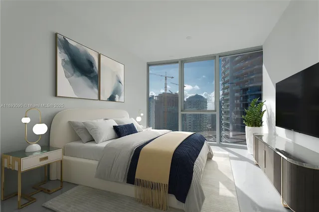 a spacious bedroom with a large bed and a flat screen tv