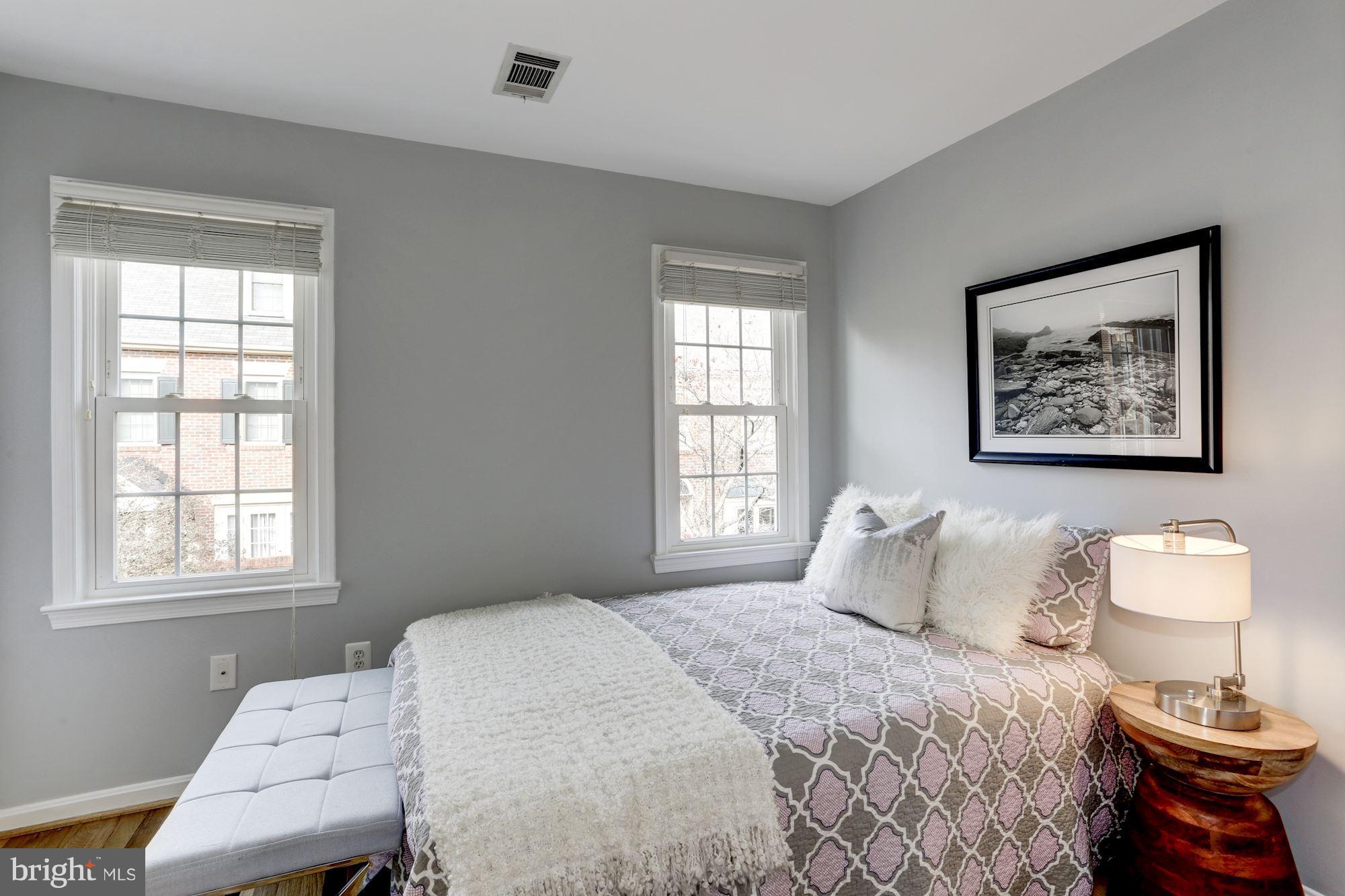 1221 Portner Road Alexandria, VA 22314 - Photo 13 of 30 a bedroom with a bed and a window
