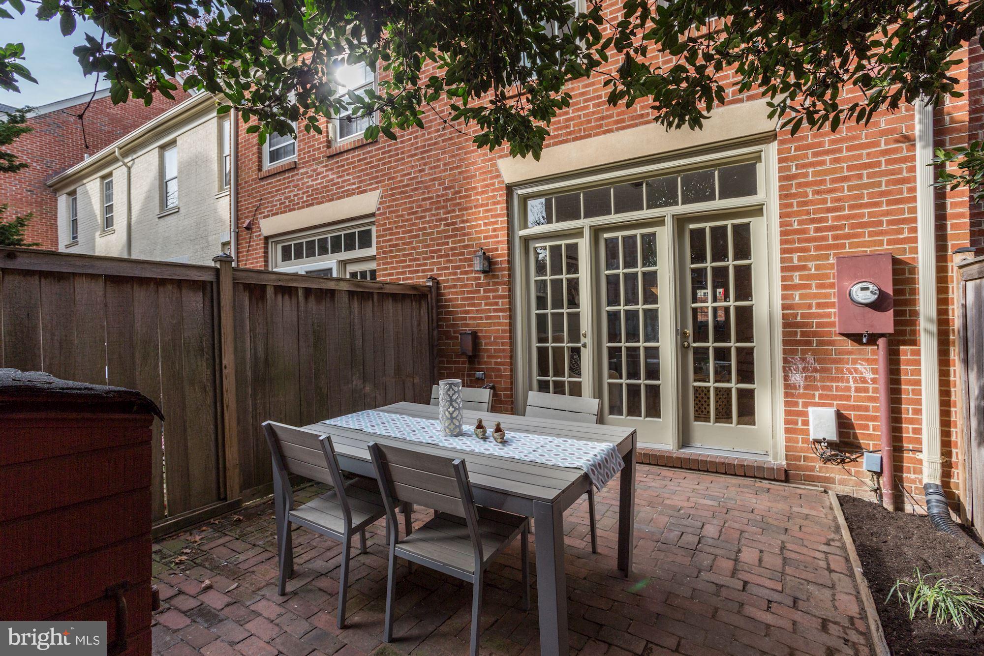 1221 Portner Road Alexandria, VA 22314 - Photo 15 of 30 a view of a dinning table and chairs in the patio