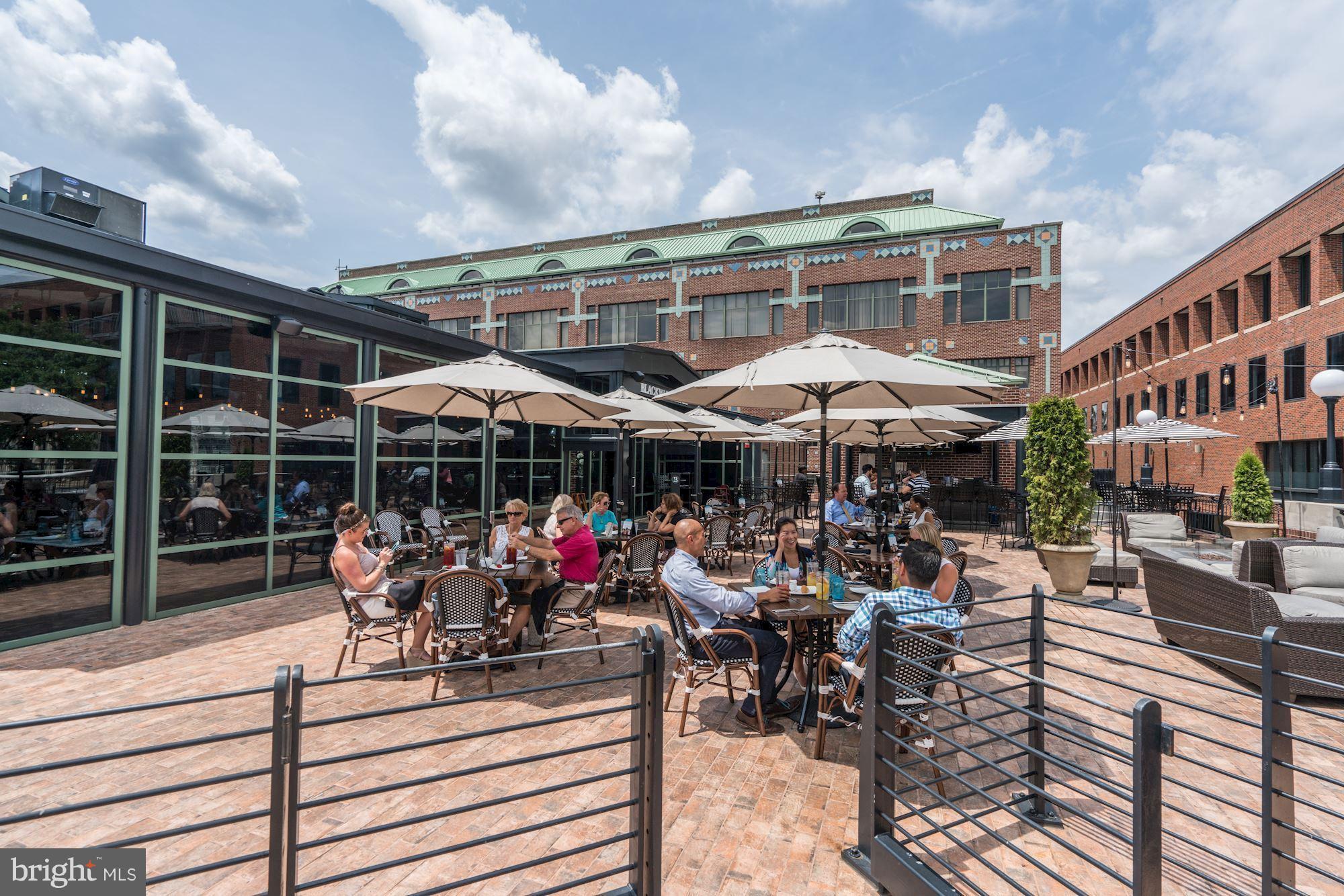 1221 Portner Road Alexandria, VA 22314 - Photo 23 of 30 a view of a chairs and table in patio with a barbeque