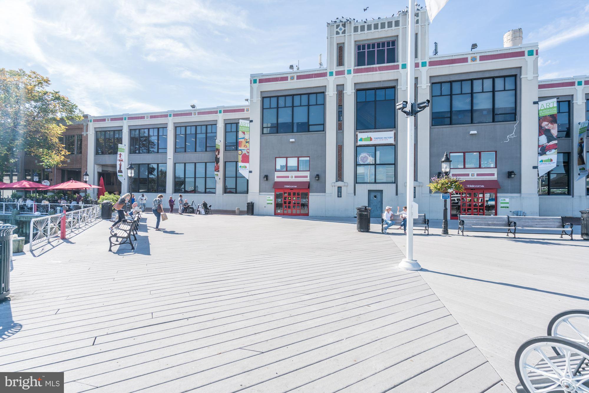 1221 Portner Road Alexandria, VA 22314 - Photo 27 of 30 a swimming pool with outdoor seating and a garden
