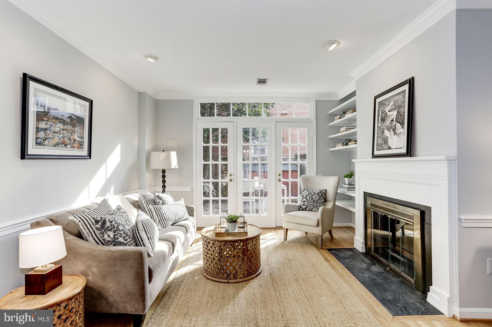 1221 Portner Road Alexandria, VA 22314 - Photo 4 of 30 a living room with furniture and a fireplace