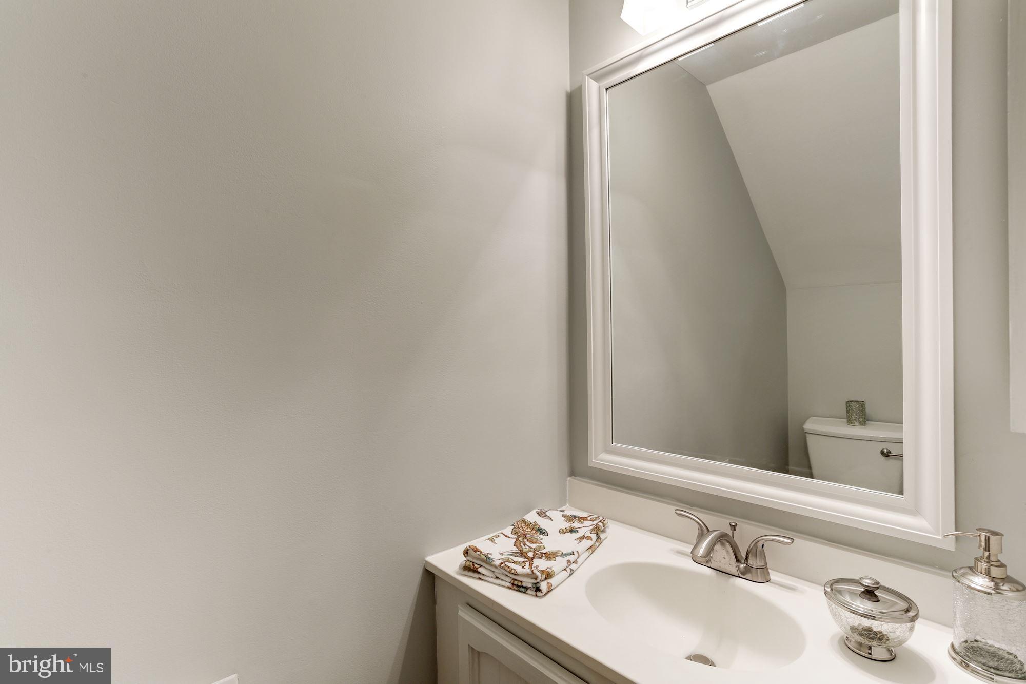 1221 Portner Road Alexandria, VA 22314 - Photo 8 of 30 a bathroom with a sink and a mirror