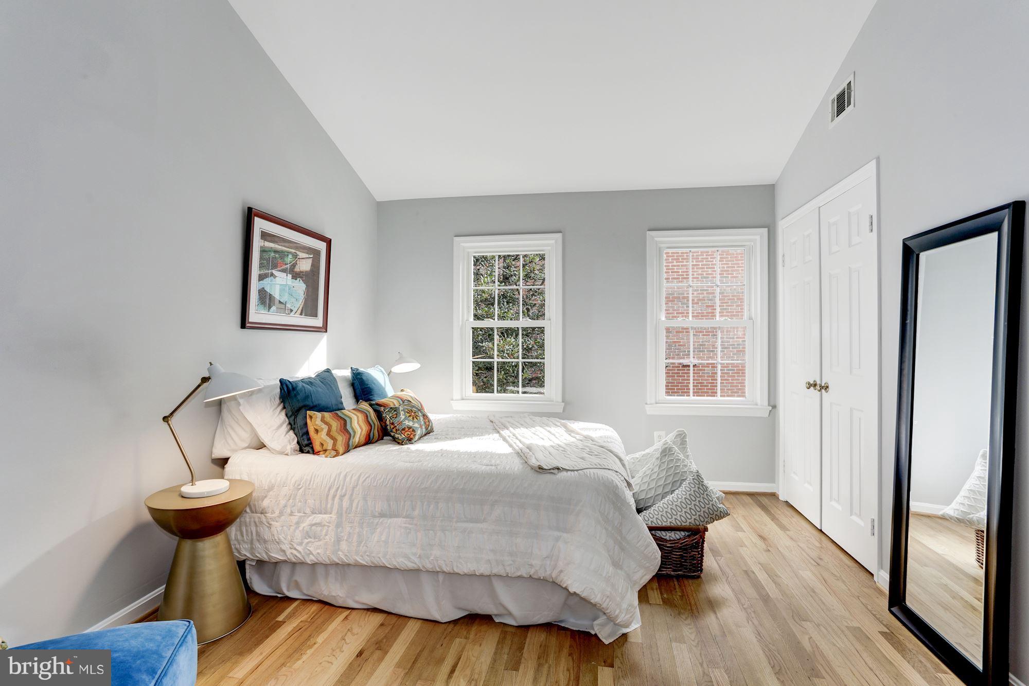1221 Portner Road Alexandria, VA 22314 - Photo 9 of 30 a bedroom with a bed and wooden floor
