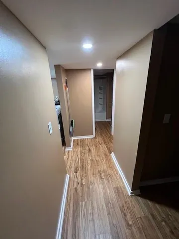 a view of entryway with wooden floor