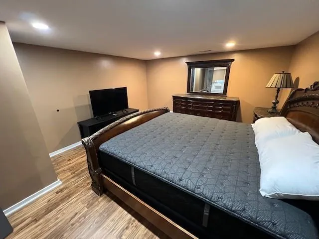 a kitchen with a counter and a flat screen tv