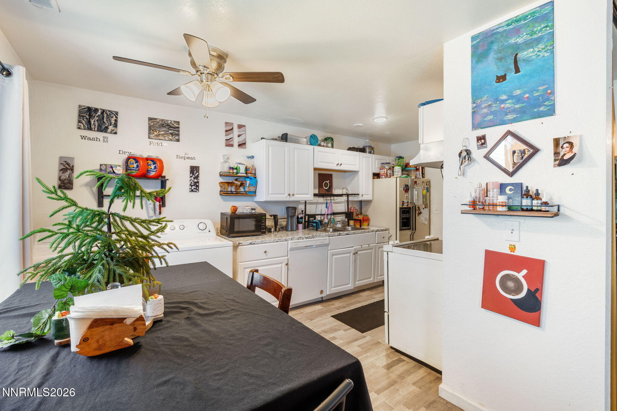 4604 Neil Road, Unit 164 Reno, NV 89502 - Photo 12 of 22 a living room with kitchen island furniture and a table