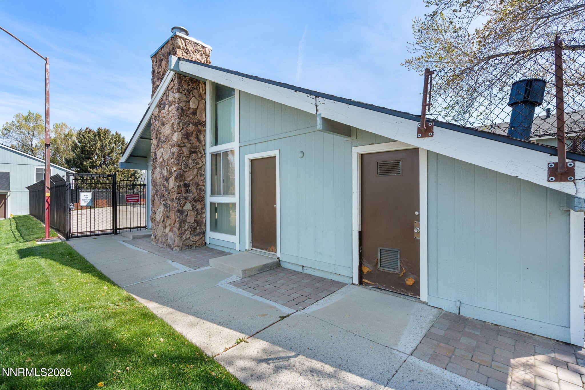 4604 Neil Road, Unit 164 Reno, NV 89502 - Photo 21 of 22 a front view of a house with garden