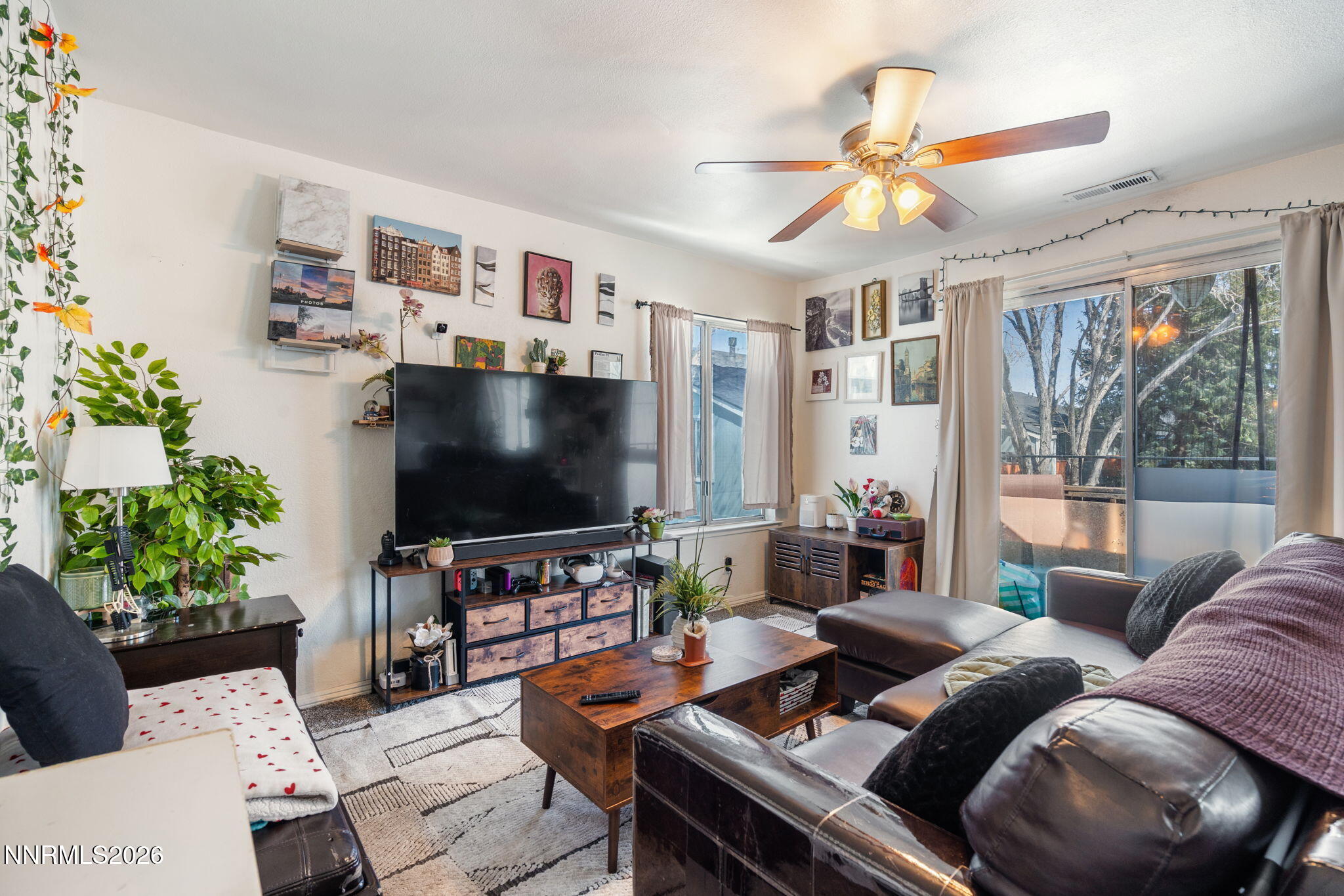 4604 Neil Road, Unit 164 Reno, NV 89502 - Photo 5 of 22 a living room with furniture and a flat screen tv