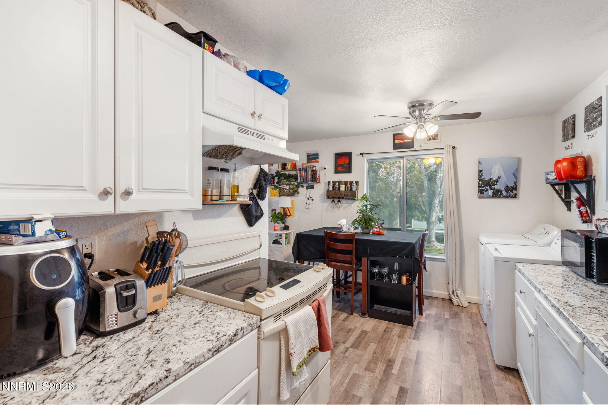 4604 Neil Road, Unit 164 Reno, NV 89502 - Photo 9 of 22 a kitchen with a sink stove and cabinets