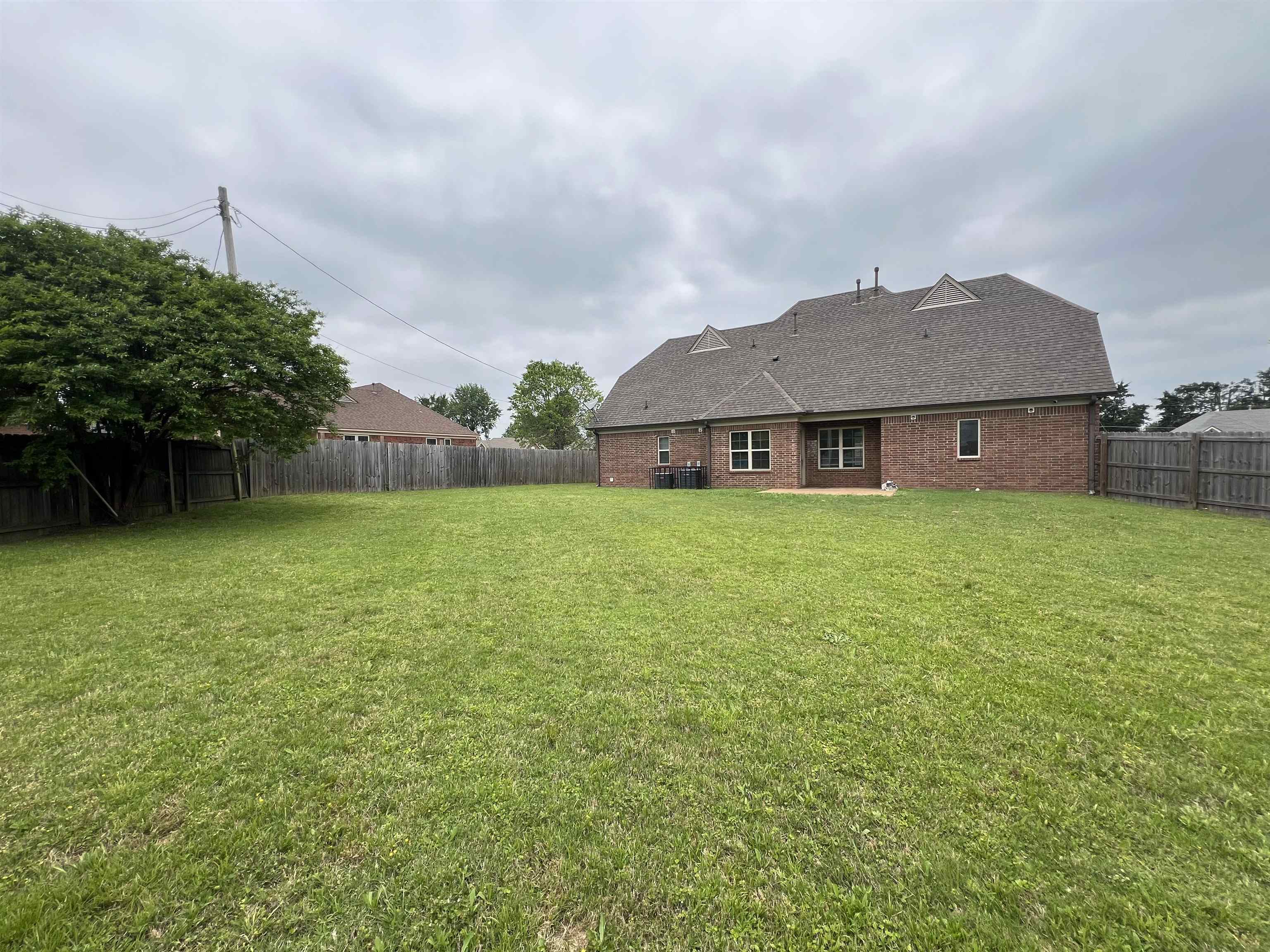 7317 Patsy Circle North Memphis, TN 38125 - Photo 23 of 26 View of yard featuring a fenced backyard