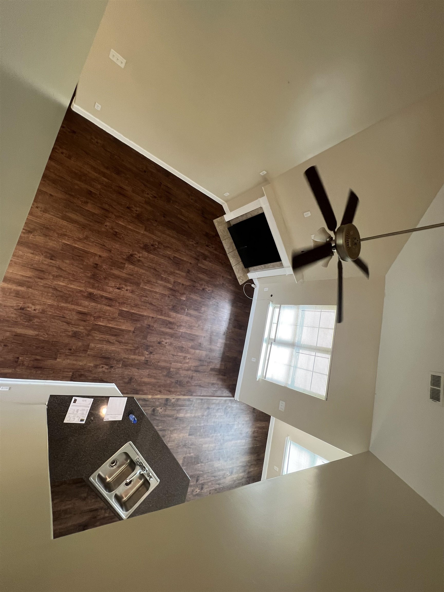 7317 Patsy Circle North Memphis, TN 38125 - Photo 25 of 26 Unfurnished living room with baseboards, ceiling fan, and wood finished floors