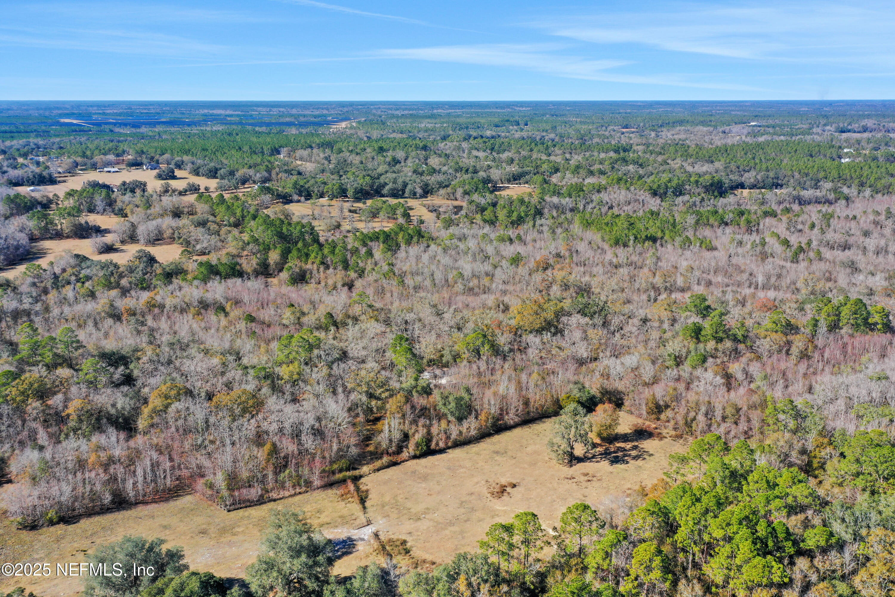 6769 Sandsdale Road Glen St. Mary, FL 32040 - Photo 15 of 31 a view of a city with lush green forest