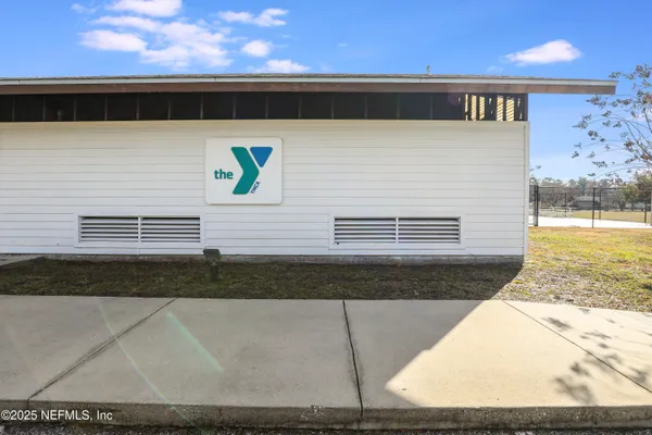 a view of a cars park in front of a house