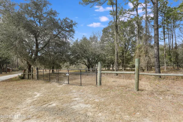 a view of backyard with green space