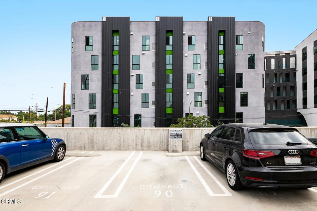 200 North San Fernando Road, Unit 416 Los Angeles, CA 90031 - Photo 5 of 21 a car parked in front of a tall building
