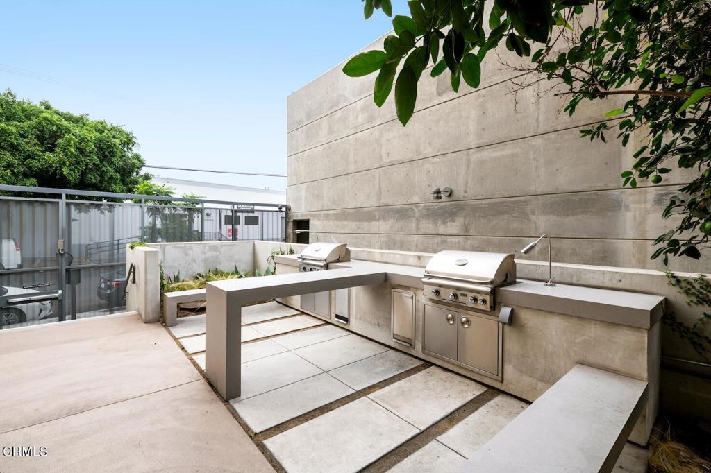 200 North San Fernando Road, Unit 416 Los Angeles, CA 90031 - Photo 8 of 21 a view of a kitchen with a sink and a table in a patio