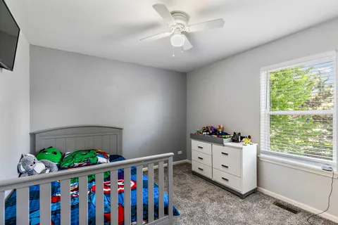 a room with toys and a baby crib