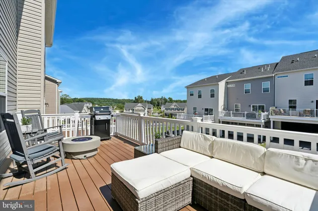 a roof deck with a table and chairs