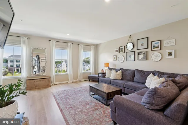 a living room with furniture and windows