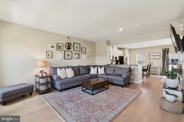 a living room with furniture and a rug