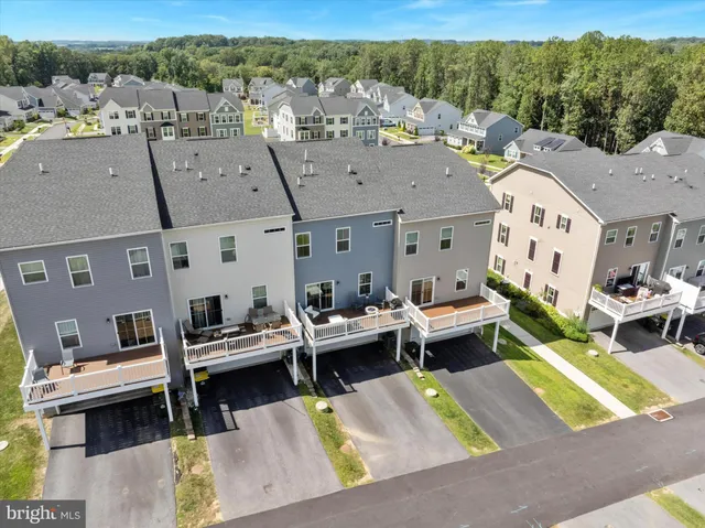 an aerial view of a house with outdoor space