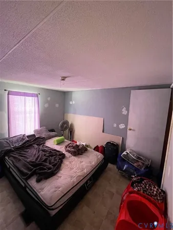 a bed room with a bed and a couch