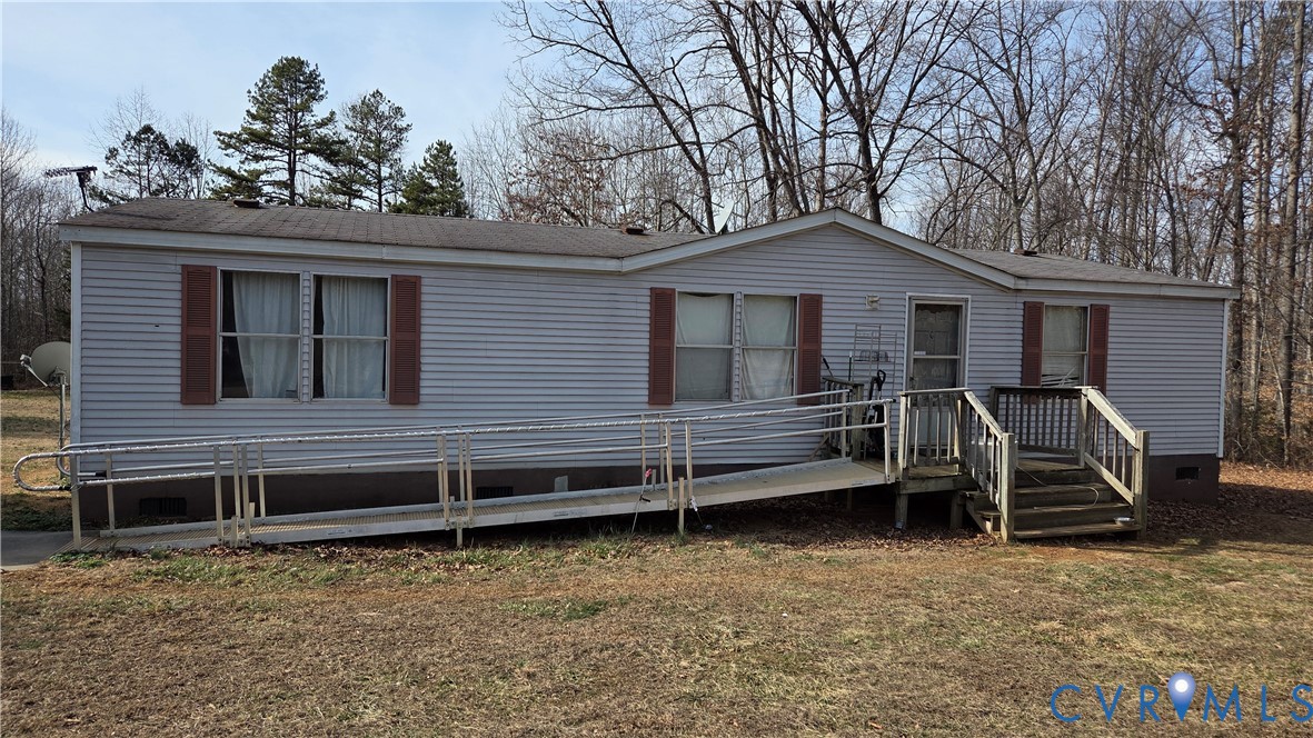 591 Byrd Mill Road Louisa, VA 23093 - Photo 2 of 13 a house with trees in the background