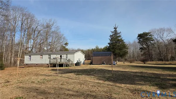 a view of house with outdoor space and sitting area