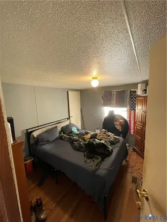 a bed room with furniture and window