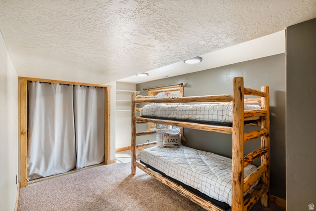 2013 North River View Road Huntsville, UT 84317 - Photo 30 of 53 Bedroom featuring a textured ceiling and carpet