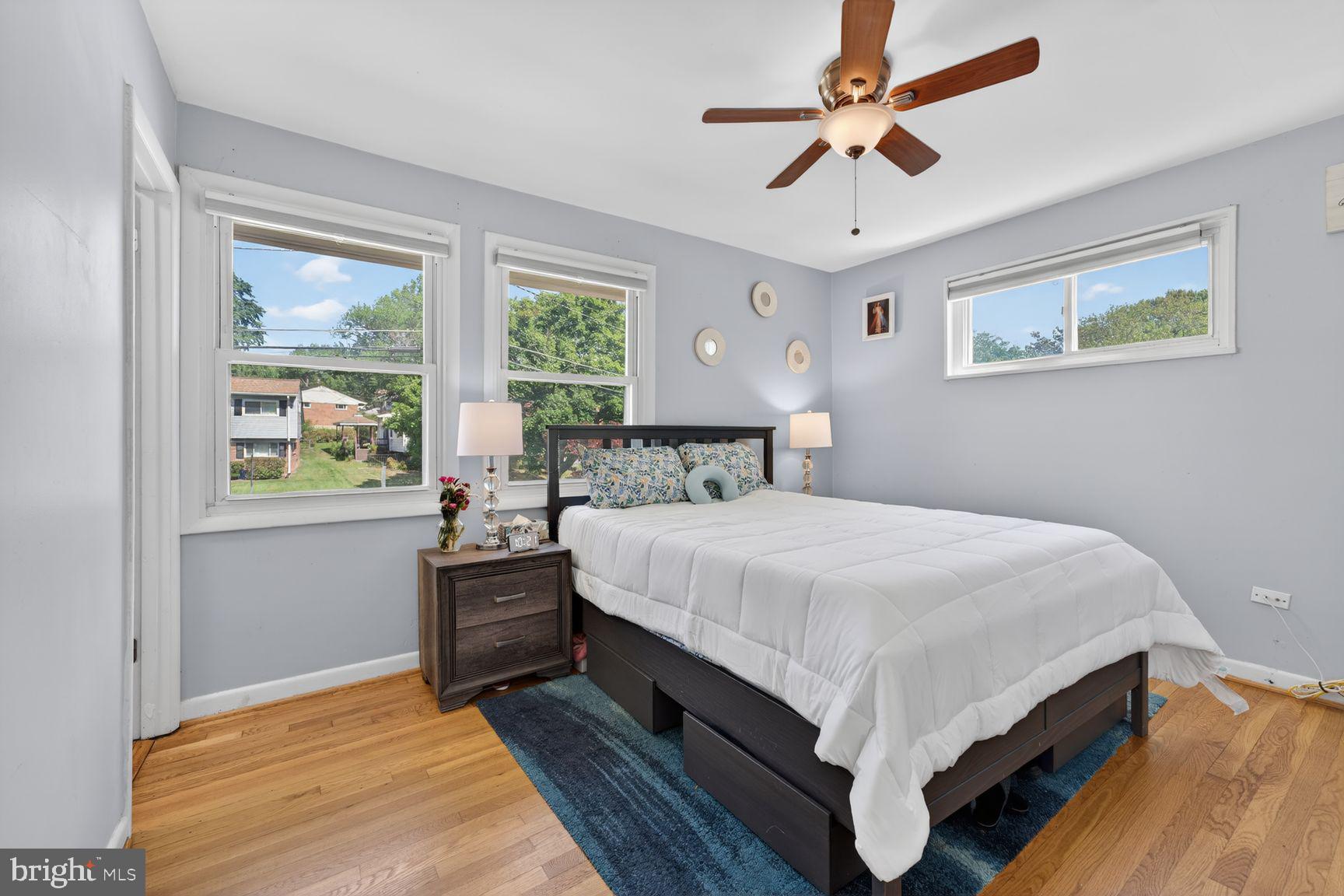 1104 Caddington Avenue Silver Spring, MD 20901 - Photo 13 of 35 a bedroom with a large bed and a window