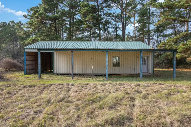 a view of an empty room with furniture