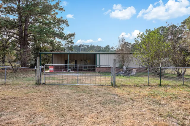 a large kitchen with a table and chairs