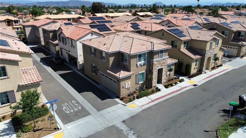 an aerial view of a residential apartment building with a yard