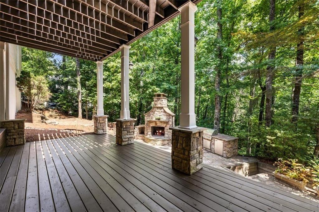 3910 Two Rivers Drive Cumming, GA 30041 - Photo 88 of 110 a patio with lawn chairs and wooden floor