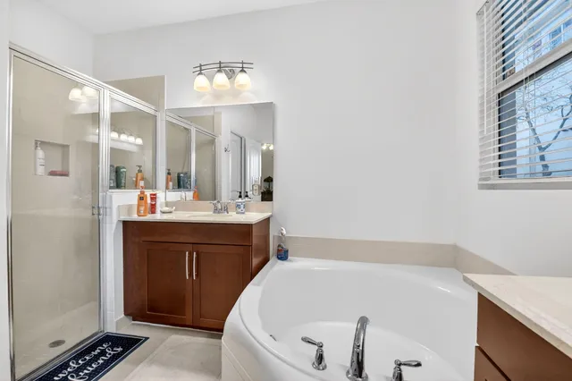 a bathroom with a bathtub and a sink