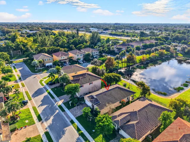 an aerial view of residential houses with outdoor space