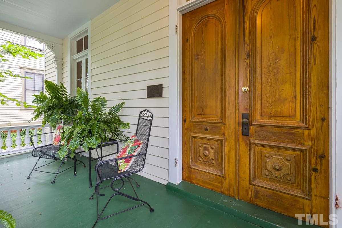 515 Polk Street Raleigh, NC 27604 - Photo 3 of 25 a balcony with table and chairs