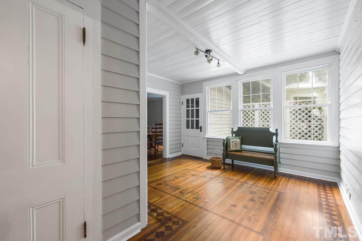 515 Polk Street Raleigh, NC 27604 - Photo 21 of 25 a living room with furniture a window and wooden floor