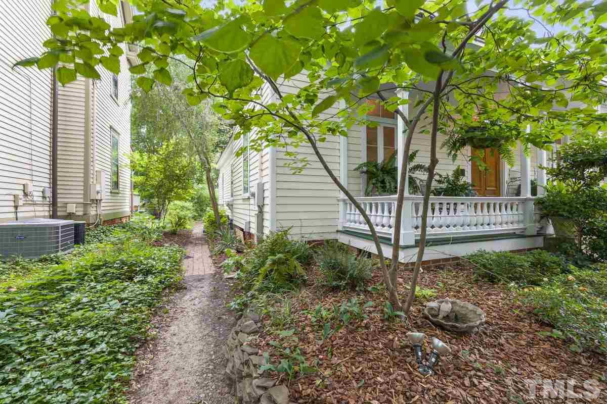 515 Polk Street Raleigh, NC 27604 - Photo 23 of 25 a view of a house with a small yard and large tree