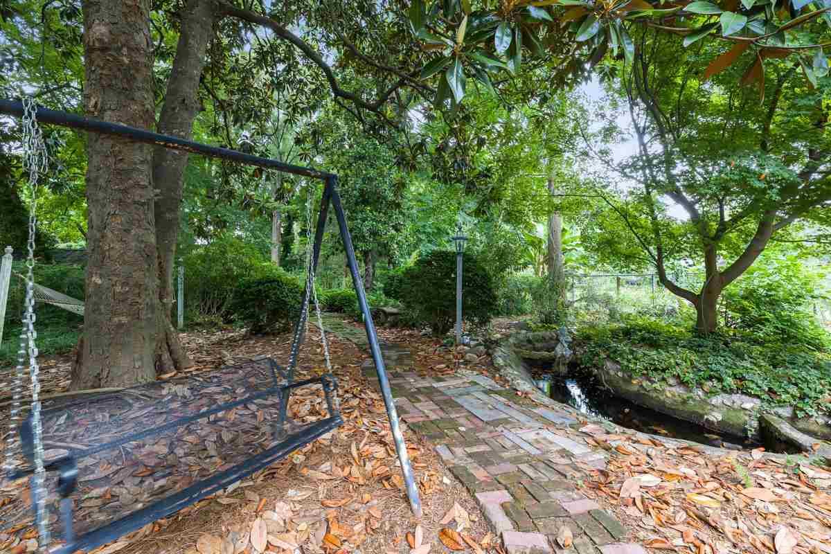 515 Polk Street Raleigh, NC 27604 - Photo 24 of 25 a view of a backyard with plants and large trees