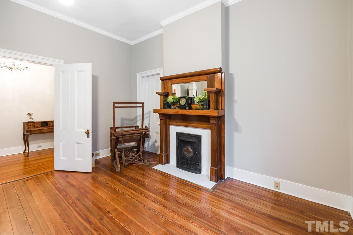515 Polk Street Raleigh, NC 27604 - Photo 7 of 25 a living room with furniture and a fireplace