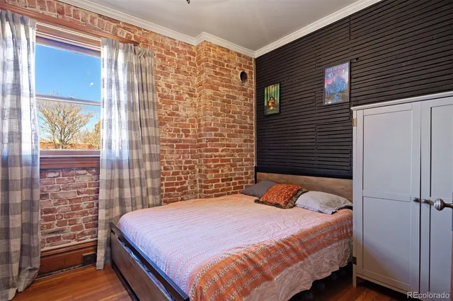 a bedroom with a bed and a shower