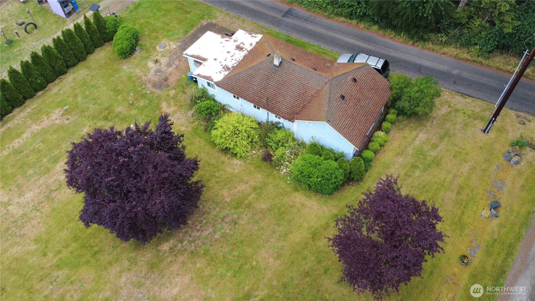 81 Hunt Road Port Hadlock, WA 98339 - Photo 18 of 20 a aerial view of a house with a garden and swimming pool