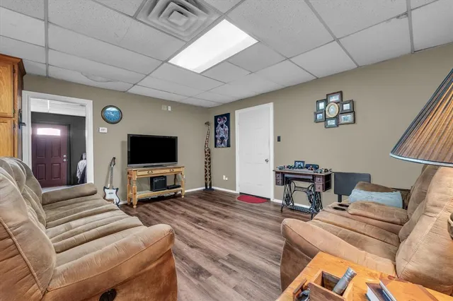 a kitchen with refrigerator cabinets and wooden floor