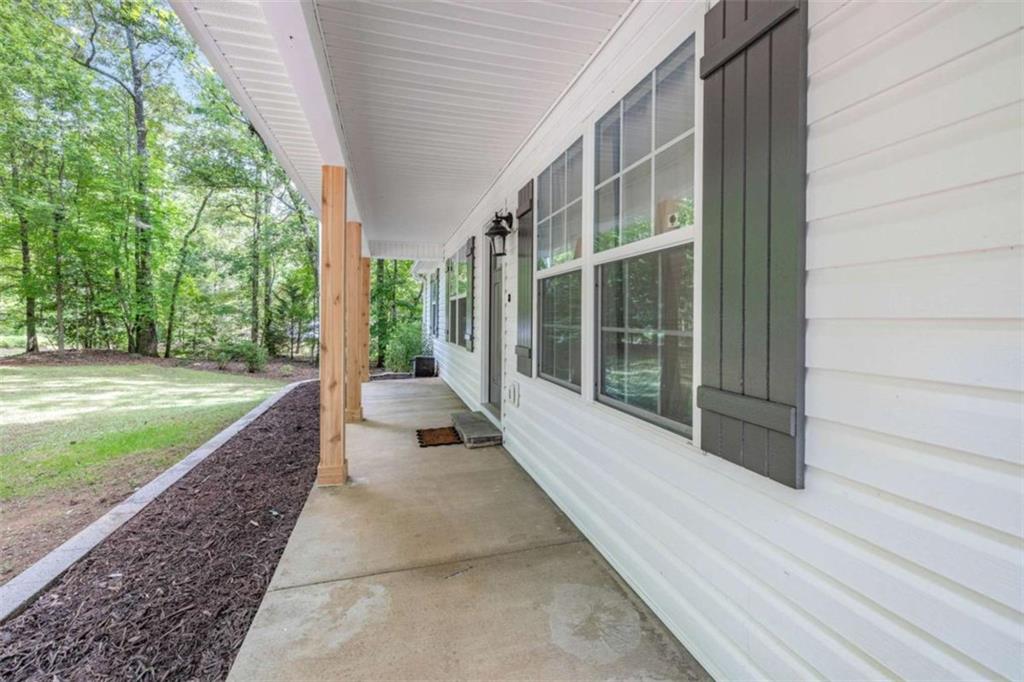 148 Hiawatha Hills Road Cleveland, GA 30528 - Photo 1 of 1 a view of a house with backyard and porch