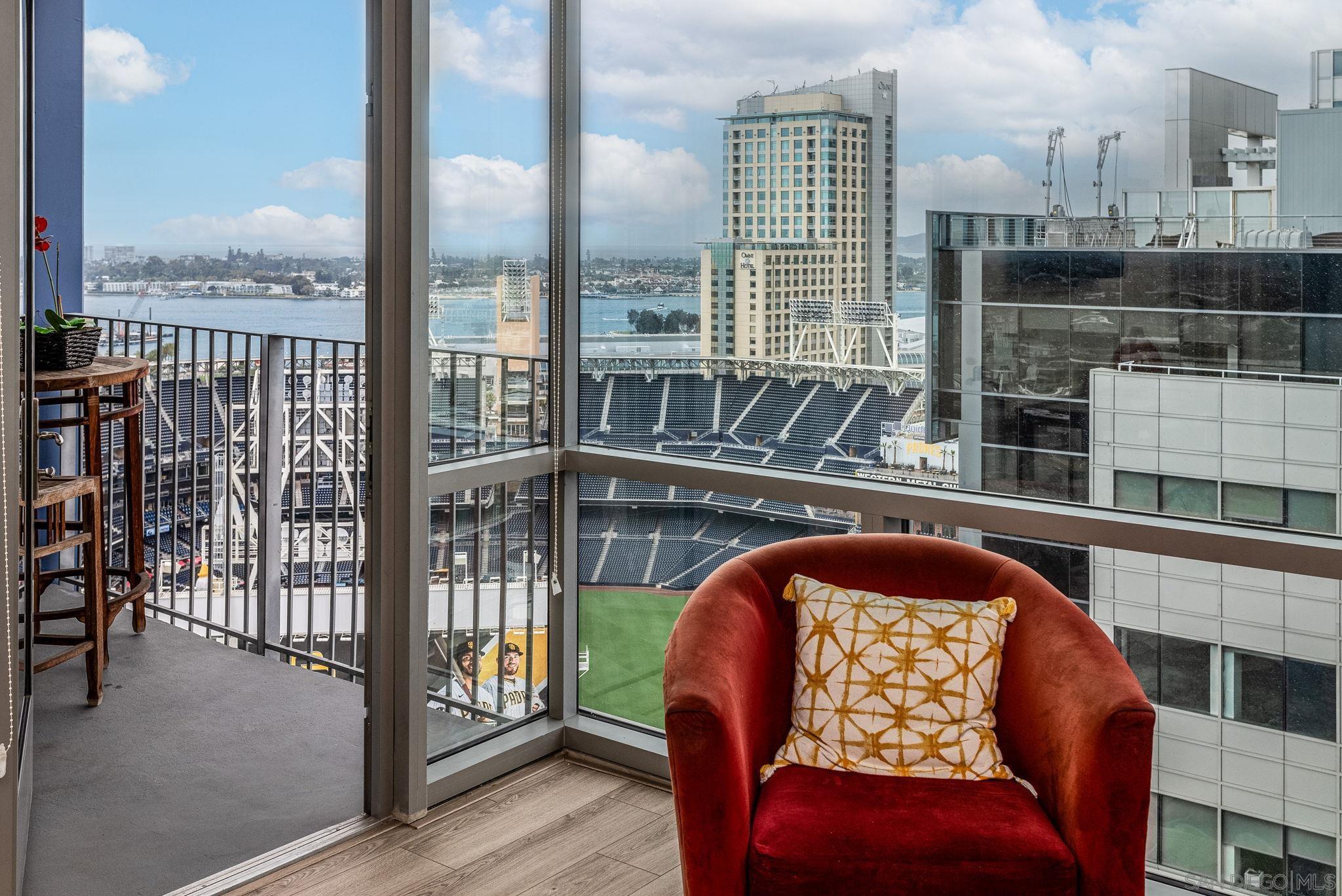 a balcony with furniture and city view
