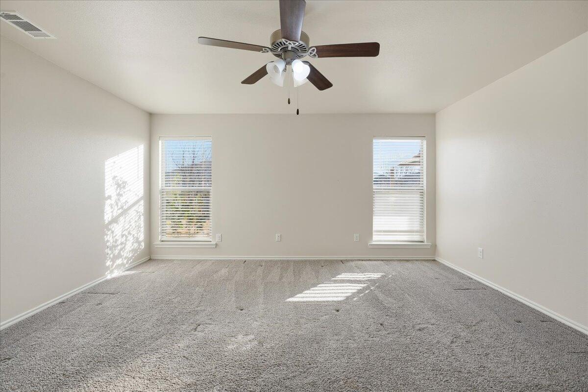 9819 Virginia Avenue Lubbock, TX 79424 - Photo 14 of 29 a view of an empty room with a window