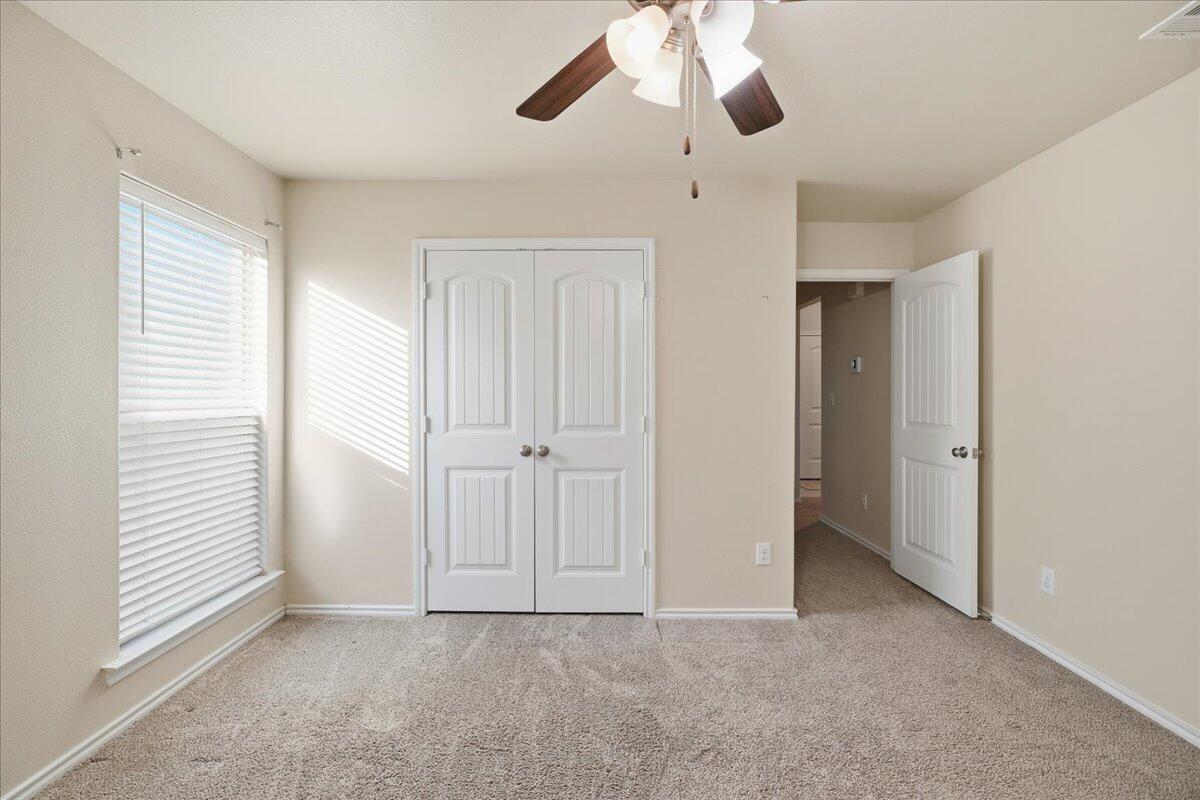 9819 Virginia Avenue Lubbock, TX 79424 - Photo 25 of 29 wooden floor in an empty room with a window